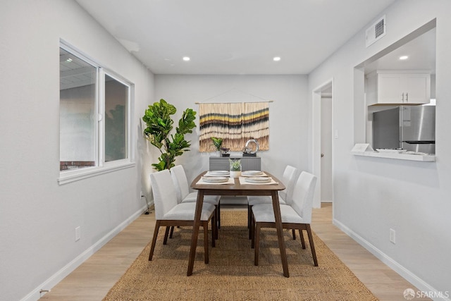 dining room with light hardwood / wood-style flooring