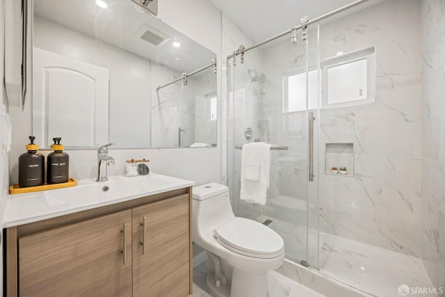 bathroom featuring toilet, walk in shower, and vanity