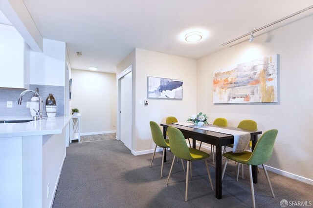 1360 9th Ave Unit 7, San Francisco, CA 94122 - dining room featuring dark colored carpet and baseboards