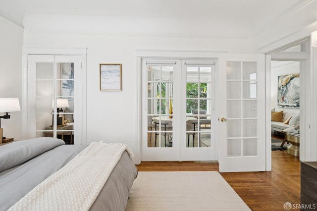 1205 Oak St Unit 2, San Francisco, CA 94117 - bedroom with french doors, wood finished floors, and a closet