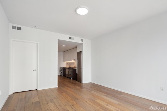 1433 Bush St Unit 702, San Francisco, CA 94109 - spare room with light hardwood / wood-style floors