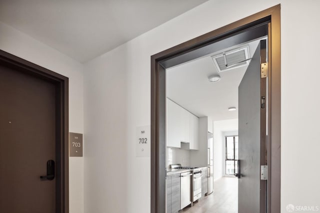 1433 Bush St Unit 702, San Francisco, CA 94109 - corridor featuring light wood-type flooring