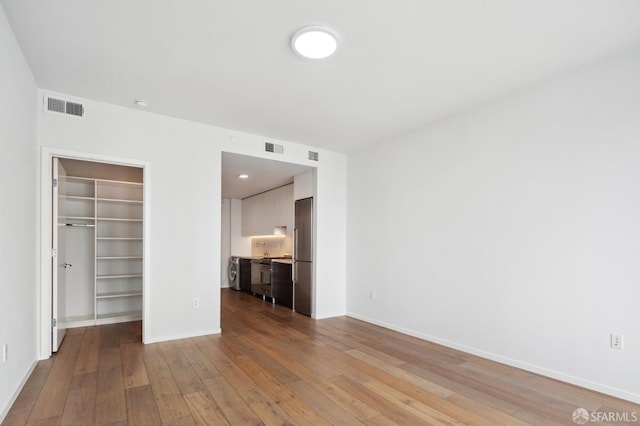 1433 Bush St Unit 702, San Francisco, CA 94109 - unfurnished bedroom featuring light wood-type flooring and a closet