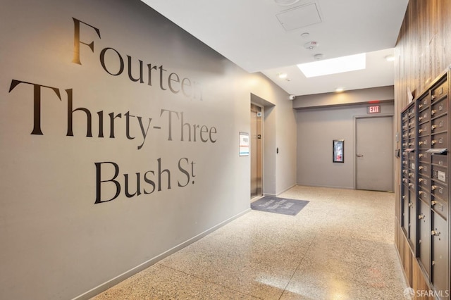 1433 Bush St Unit 702, San Francisco, CA 94109 - hallway featuring speckled floor, baseboards, and elevator