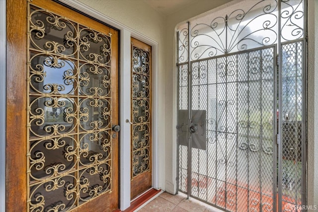 doorway to outside featuring tile patterned floors