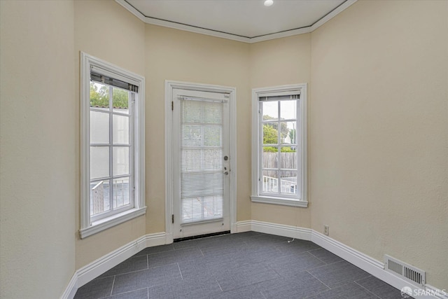 doorway to outside featuring crown molding