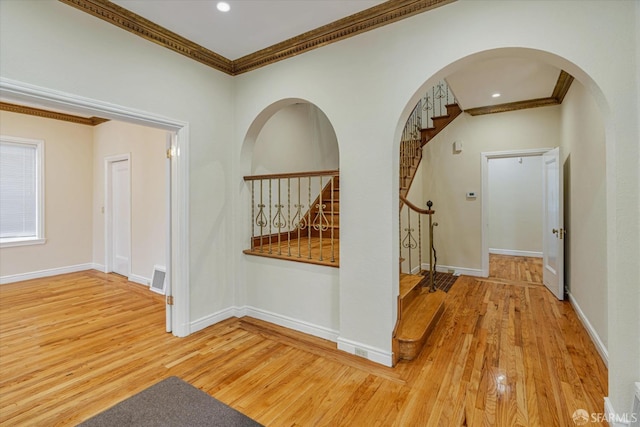 hallway featuring crown molding and hardwood / wood-style flooring