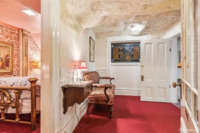 sitting room with wainscoting and carpet