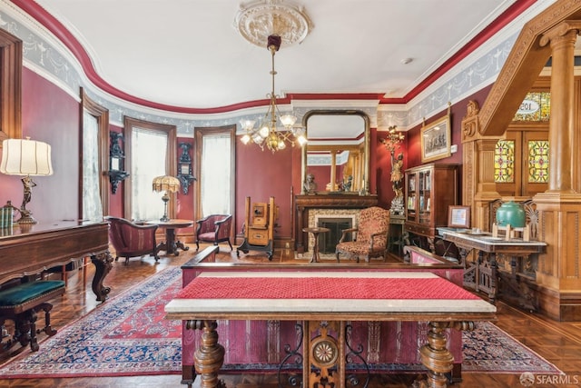 dining room featuring ornamental molding, a notable chandelier, and ornate columns