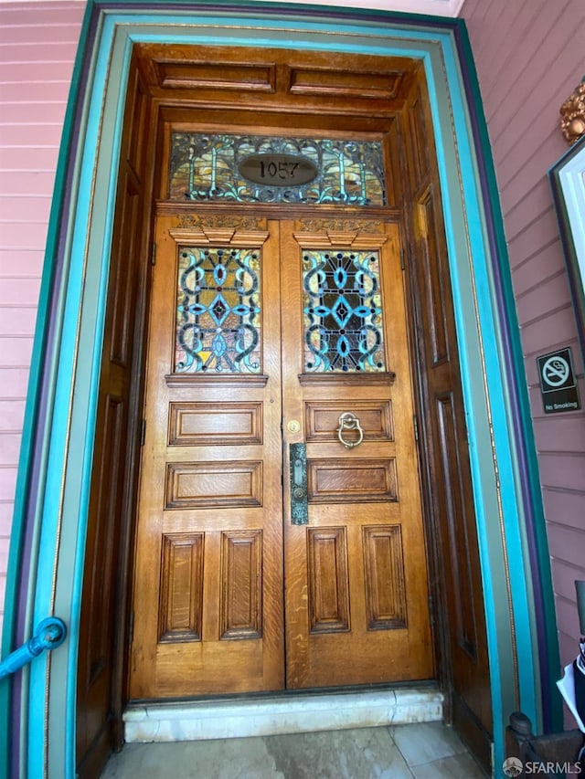 doorway to property featuring a porch