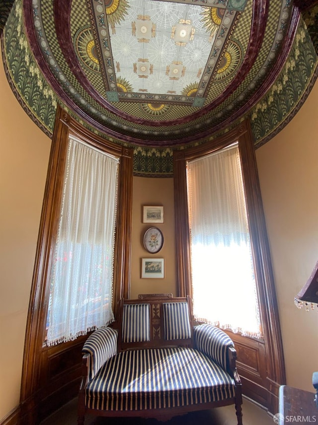 living area featuring ornamental molding