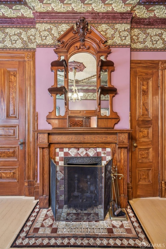details featuring a tiled fireplace