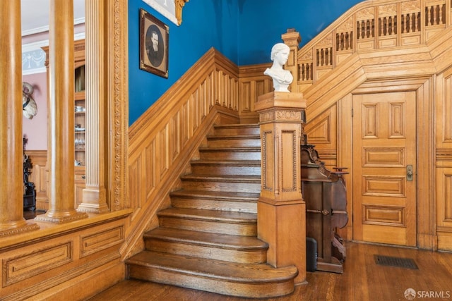 stairway featuring wood finished floors