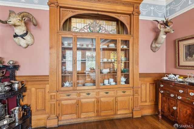 interior space with crown molding and dark hardwood / wood-style floors