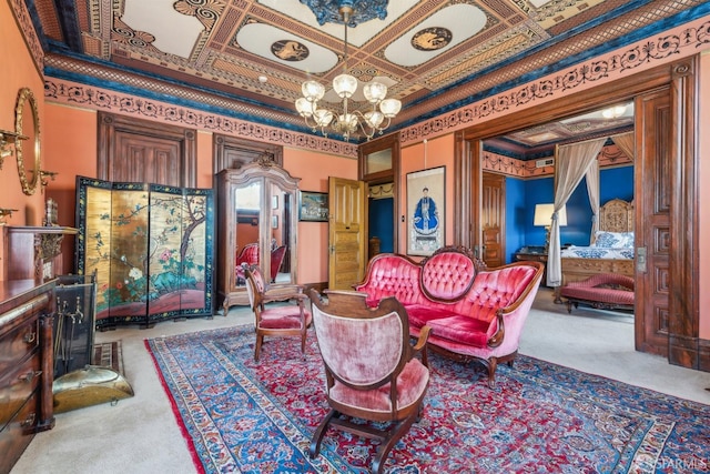 sitting room featuring coffered ceiling, a notable chandelier, ornamental molding, and carpet floors