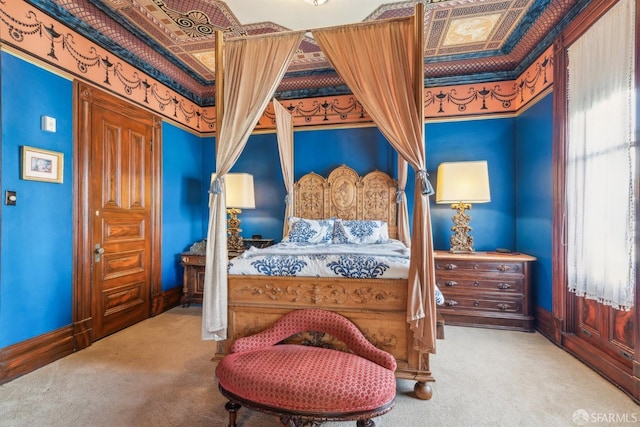 bedroom with carpet floors and baseboards
