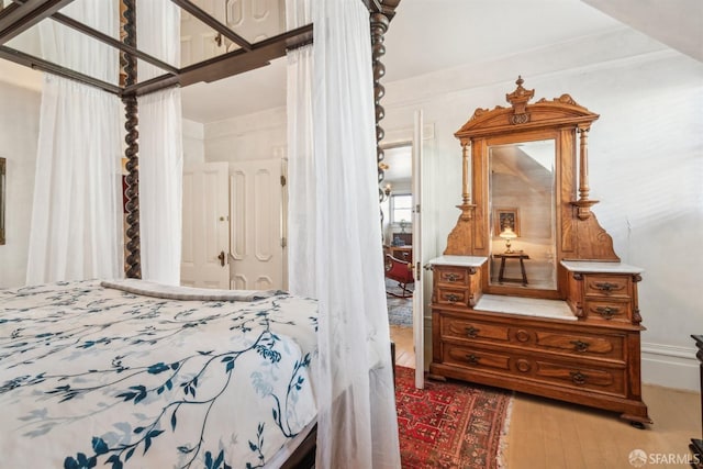 bedroom featuring wood finished floors