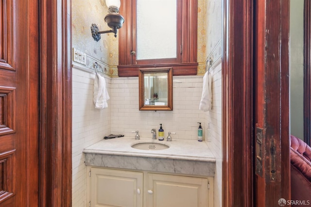 bathroom with vanity and decorative backsplash