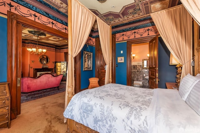 carpeted bedroom featuring ensuite bathroom and an inviting chandelier