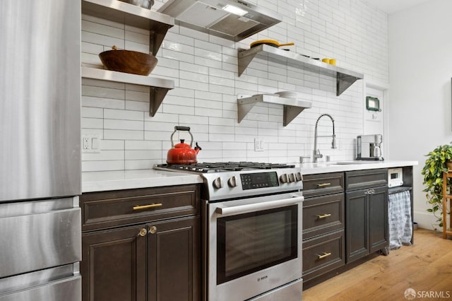 837 Union St, San Francisco, CA 94133 - kitchen featuring open shelves, stainless steel appliances, backsplash, ventilation hood, and light countertops