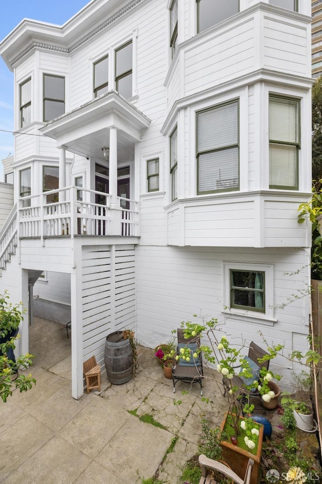 837 Union St, San Francisco, CA 94133 - rear view of house with a patio and stairs