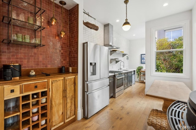 837 Union St, San Francisco, CA 94133 - kitchen featuring stainless steel appliances, backsplash, island range hood, light wood-style flooring, and recessed lighting