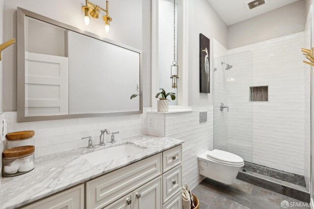 837 Union St, San Francisco, CA 94133 - bathroom featuring vanity, tiled shower, toilet, and tile walls