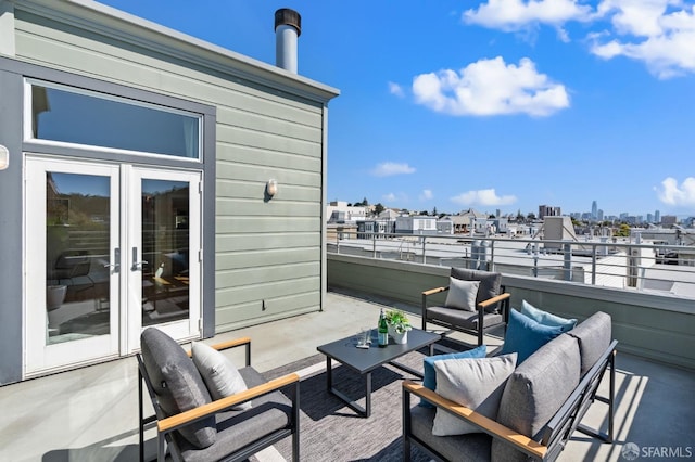 view of patio with outdoor lounge area and a balcony