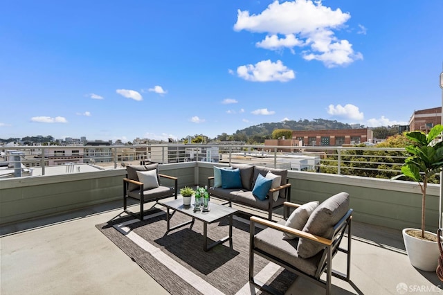 view of patio featuring a balcony and outdoor lounge area