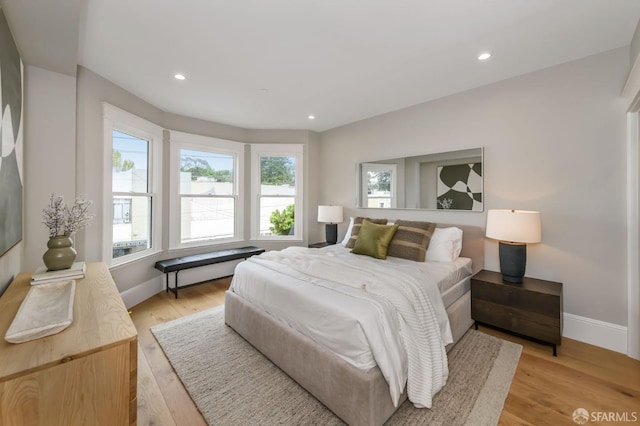 bedroom with light hardwood / wood-style flooring