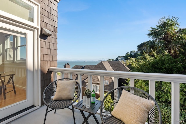 balcony featuring a water view