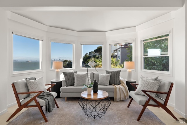 sunroom / solarium with a water view