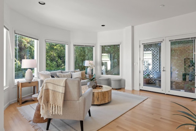 sunroom featuring plenty of natural light and french doors