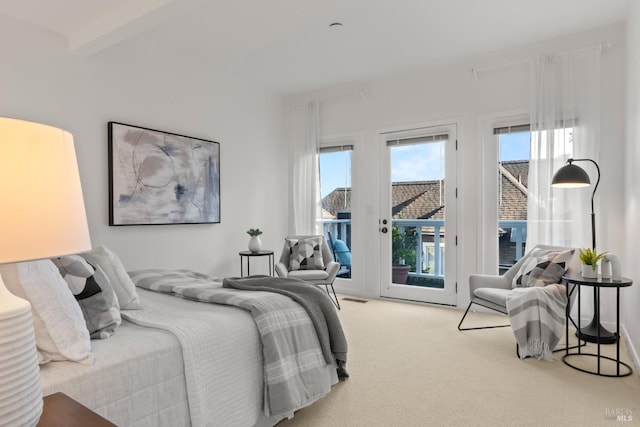 carpeted bedroom featuring access to exterior