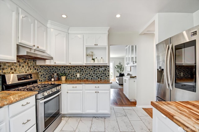 1675 Quint St, San Francisco, CA 94124 - kitchen featuring appliances with stainless steel finishes, under cabinet range hood, white cabinets, light marble finish flooring, and open shelves