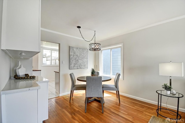 1675 Quint St, San Francisco, CA 94124 - dining area with baseboards, light wood-style flooring, and crown molding
