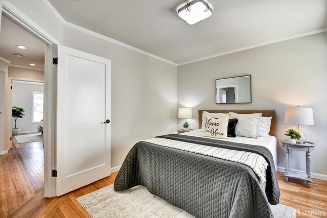1675 Quint St, San Francisco, CA 94124 - bedroom featuring ornamental molding, light wood-type flooring, and baseboards