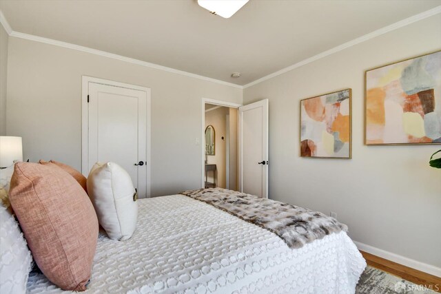 1675 Quint St, San Francisco, CA 94124 - bedroom with wood finished floors, crown molding, and baseboards