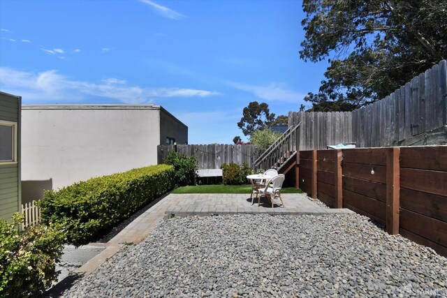 1675 Quint St, San Francisco, CA 94124 - fenced backyard featuring a patio area