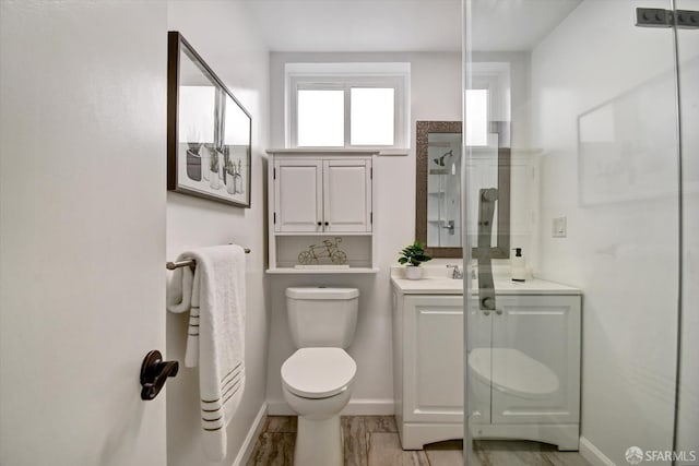 1675 Quint St, San Francisco, CA 94124 - bathroom featuring baseboards, toilet, vanity, and a stall shower
