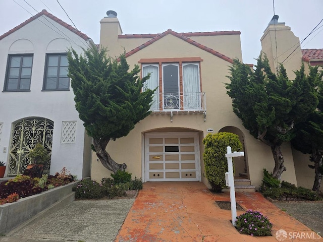 2124 18th Ave, San Francisco, CA 94116 - view of front of house with stucco siding, a balcony, a chimney, and an attached garage