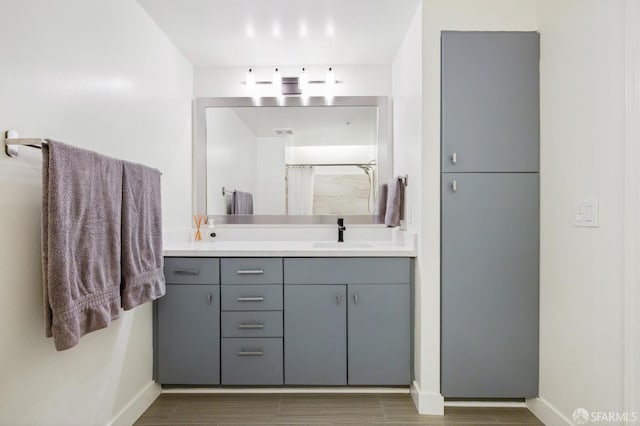 bathroom with a shower and vanity