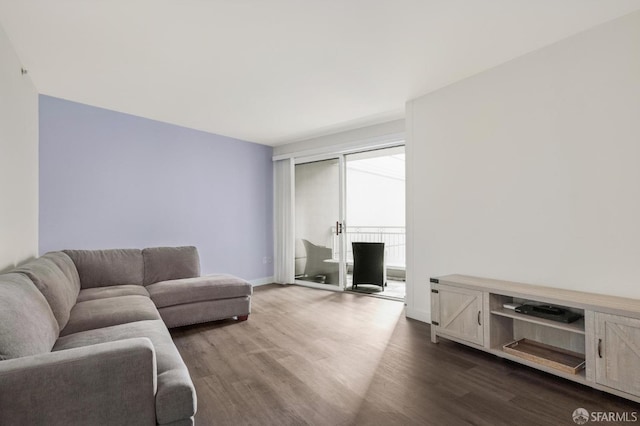 living room featuring dark wood-type flooring