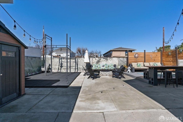 view of patio / terrace with outdoor lounge area and a bar