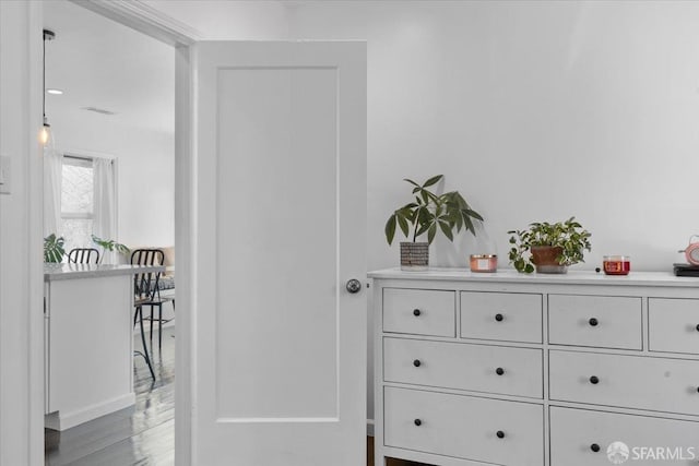 hall with hardwood / wood-style floors