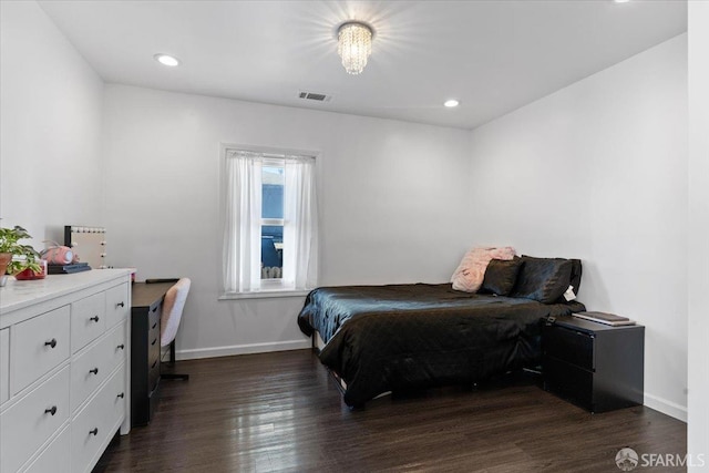 bedroom featuring dark wood-type flooring