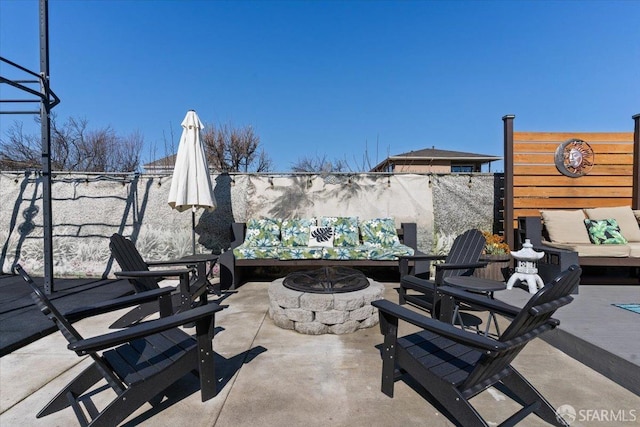 view of patio / terrace with a fire pit