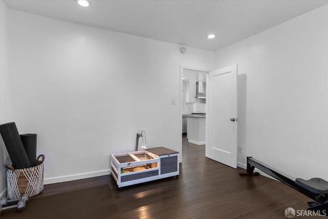 sitting room featuring dark wood-type flooring