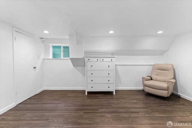 unfurnished room with dark wood-type flooring