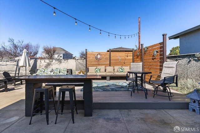 wooden deck with a bar
